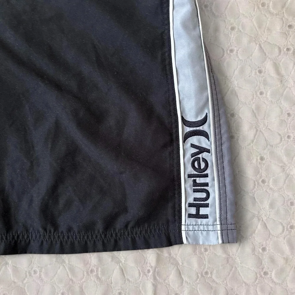 Hurley black and grey board shorts with gray side panels, size 38/XL